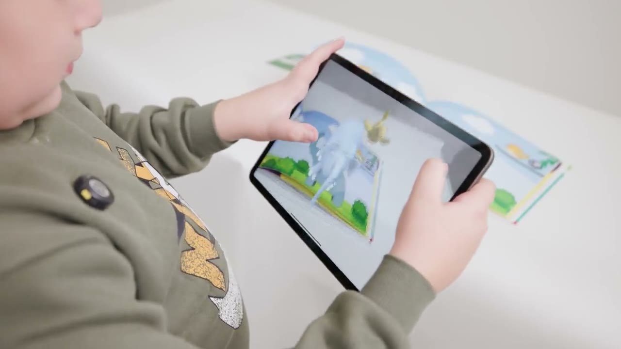 A child exploring an interactive AR schoolbook